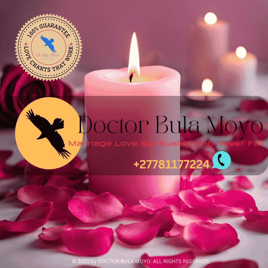A burning pink candle surrounded by rose petals and cinnamon for an attraction spell.