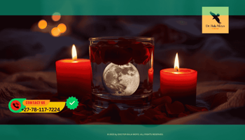 Glass of moon water with rose petals and red candles for love attraction spell.