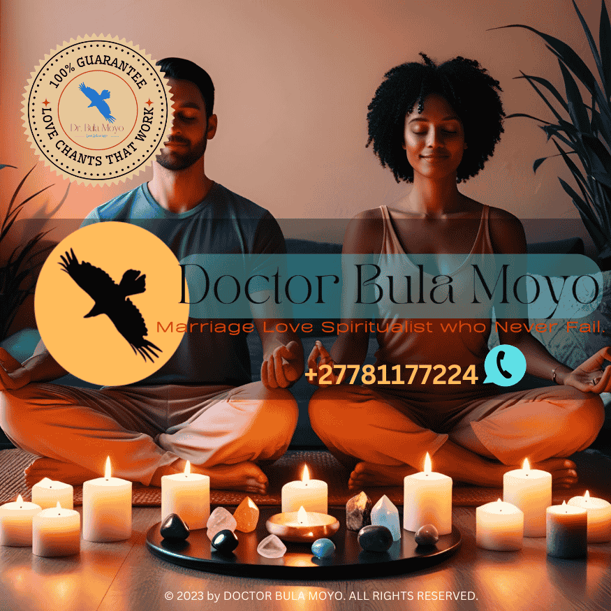 A couple meditating with protection candles and crystals between them.