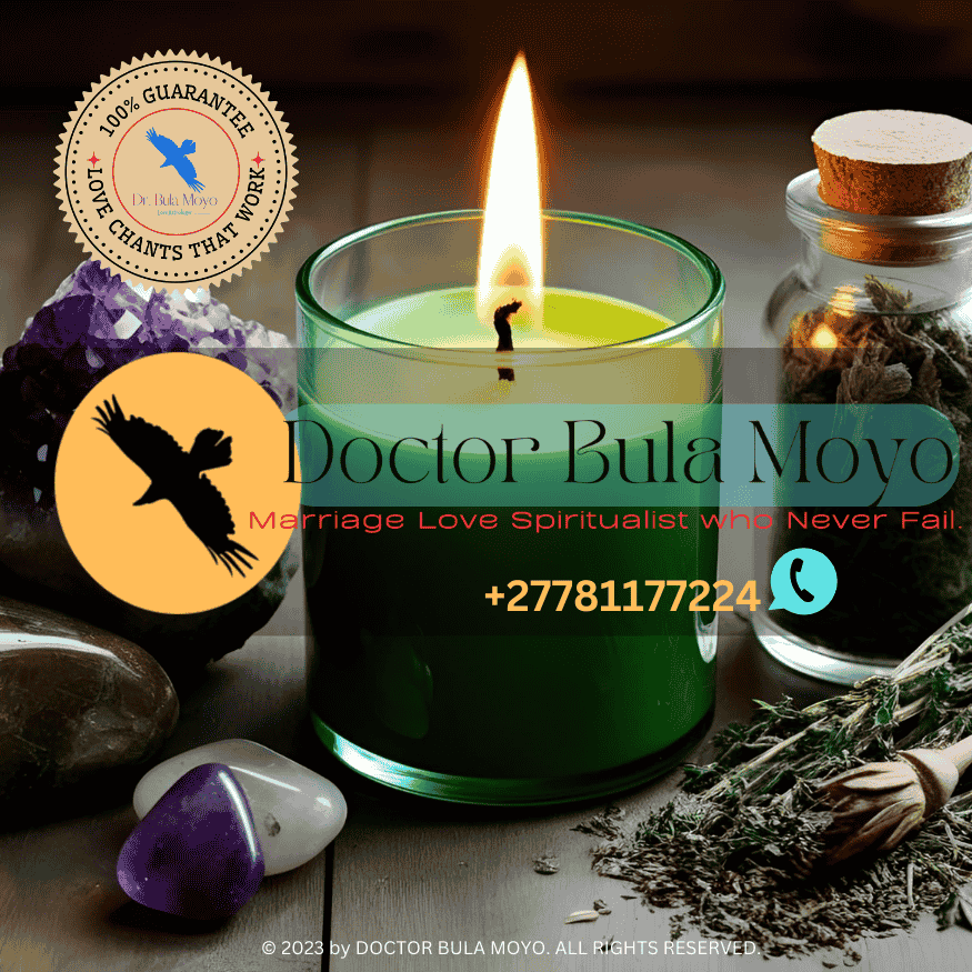 A green candle burning next to fertility crystals and herbs. (3)