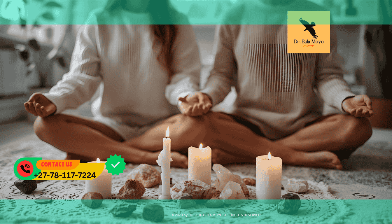 Couple meditating together with candles and crystals during a financial healing ritual.