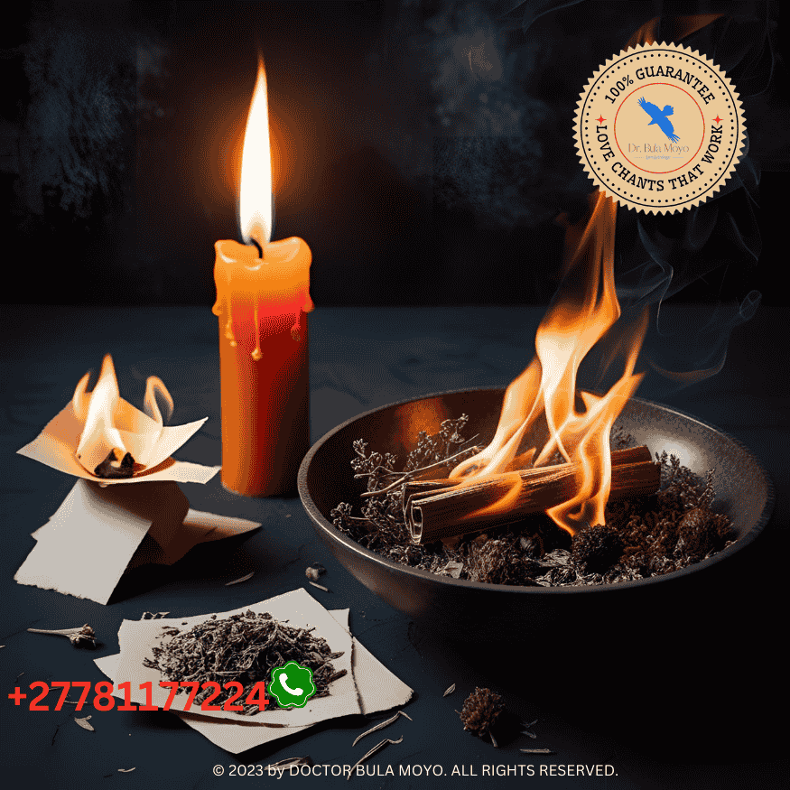 Fire spell setup with orange candle, paper burning, and herbal bowl