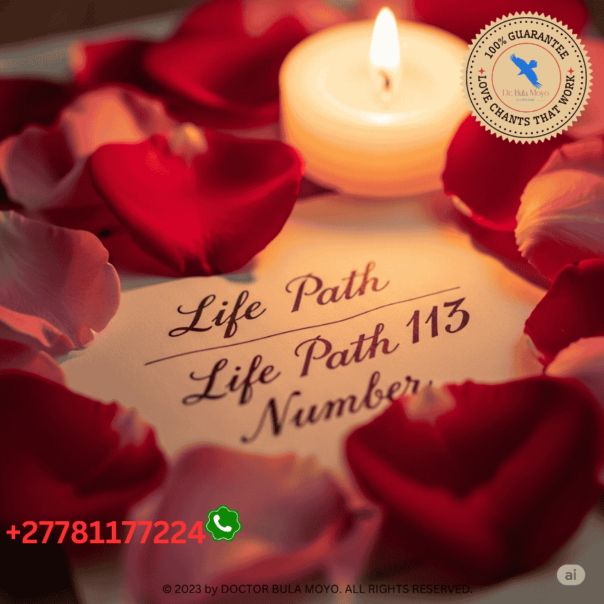 Two Life Path Numbers written on paper surrounded by rose petals and a candle.